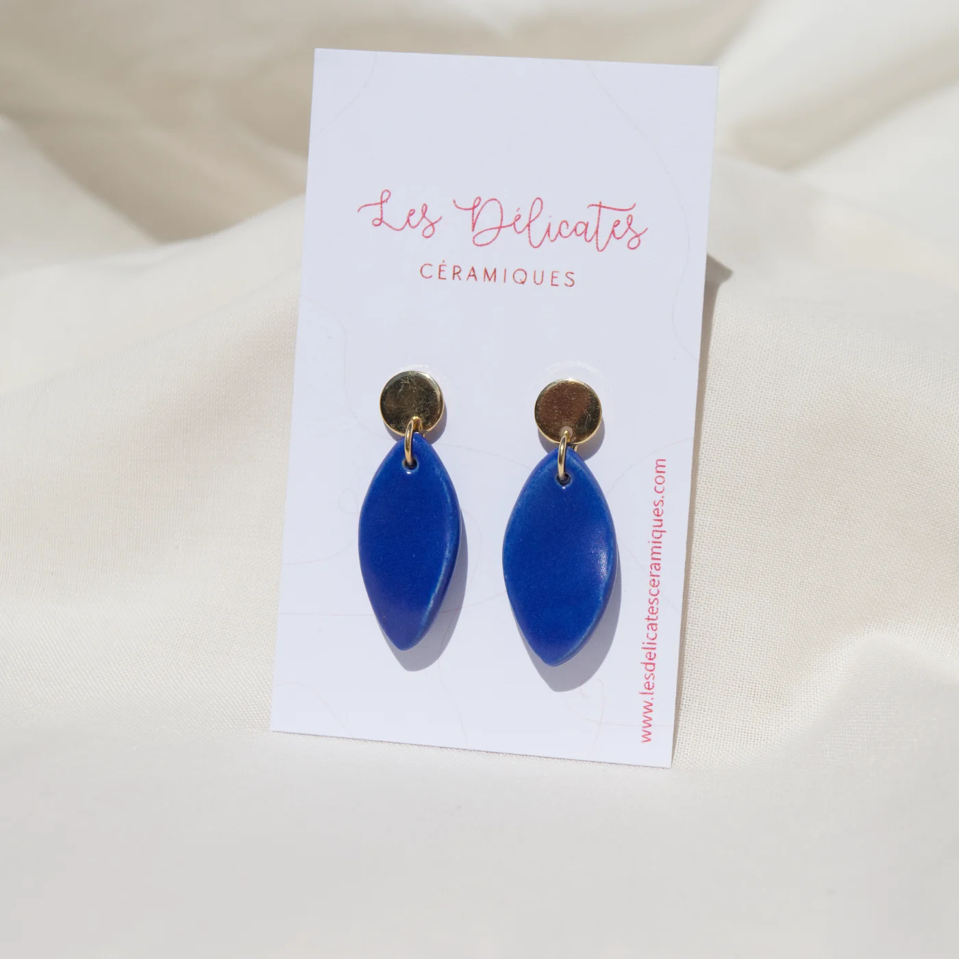 Boucles d'oreilles en forme de plumes bleues klein