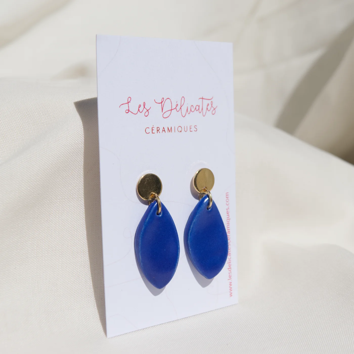 Boucles d'oreilles en forme de plumes bleues klein