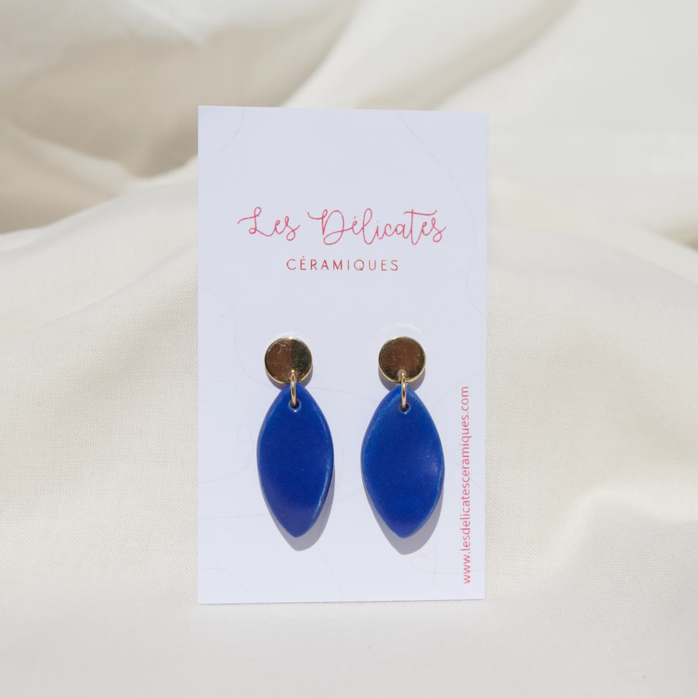 Boucles d'oreilles en forme de plumes bleues klein